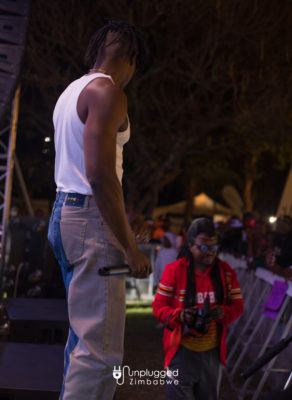 Larry Kwirirayi in a rare walkabout gesture during LADIPOE’s performance at Unplugged Festival on August 27, 2022. IMAGE By Alexander Gusha for Unplugged Zim